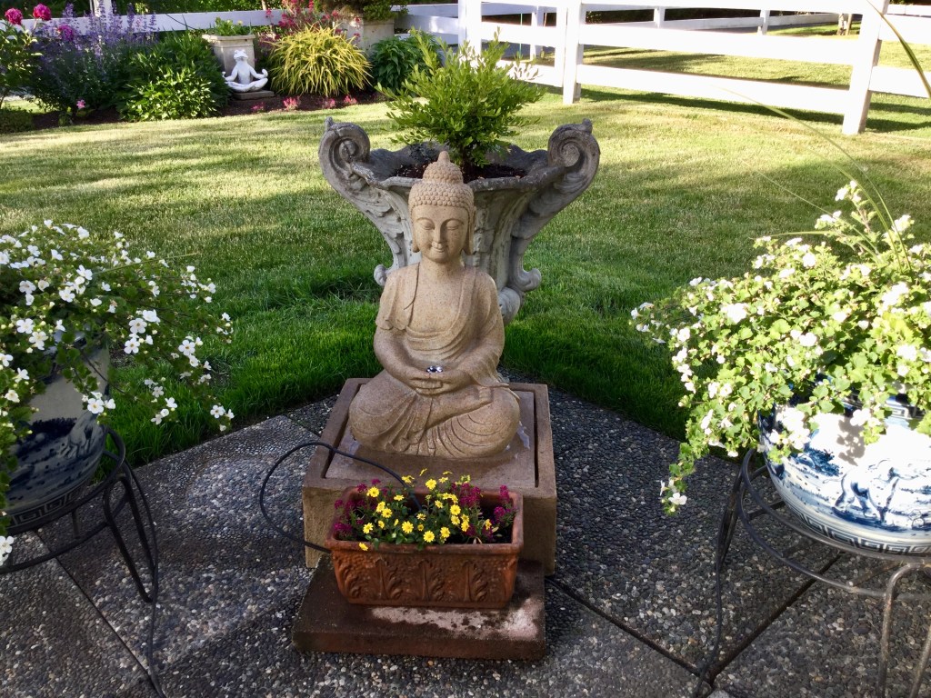 Buddha statue in Sandra Bazant's garden.